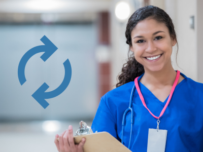 nurse smiling holding clipboard