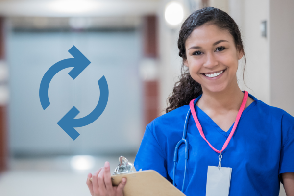 nurse smiling holding clipboard